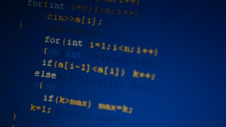Source code on the monitor screen. Source code