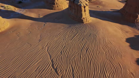 desert landscape with unique sand patterns and rock formations