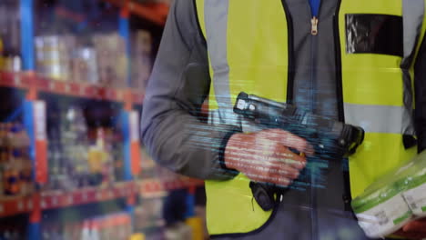 data processing against caucasian male worker using scanning device at warehouse