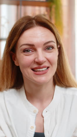 adult woman looking at camera with surprise at home wide eyes and wow expression showing excitement