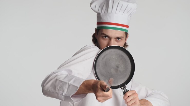 Caucasian man in front of camera on white background.
