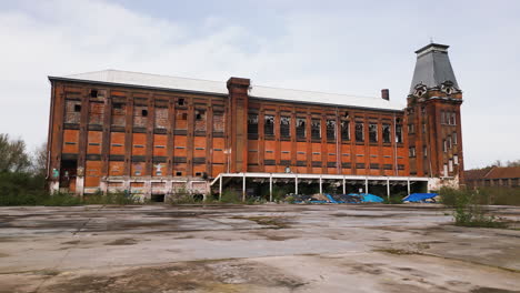 Abandoned-red-brick-industrial-building,-aerial-view