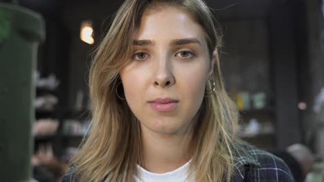 young woman smiling in a shop