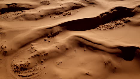 drone footage unveils the strange beauty of pink-toned sand ridges in southern utah.
