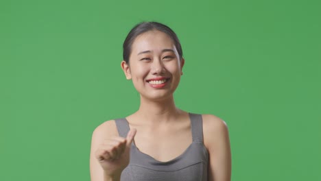 smiling young woman in grey top