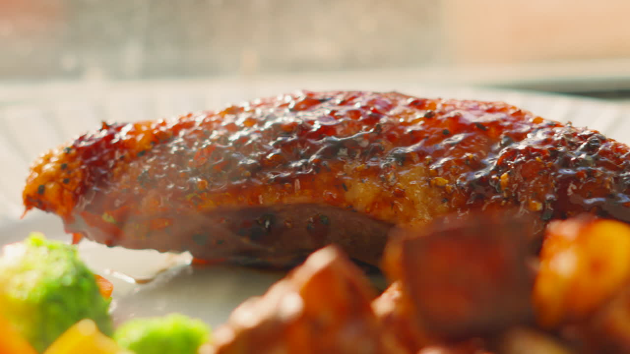 Delicious Duck Fillet in Plum Hoisin Sauce on Plate with Vegetables including Potatoes, Broccoli. Natural Sunlight Freshly Roasted Cooked High Protein Dinner Plate.