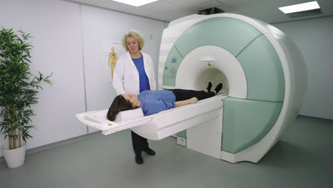 medical professional preparing a patient for an mri scan