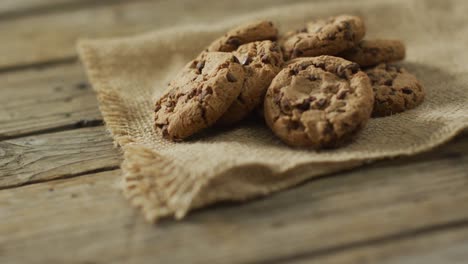 video of biscuits with chocolate on wooden background