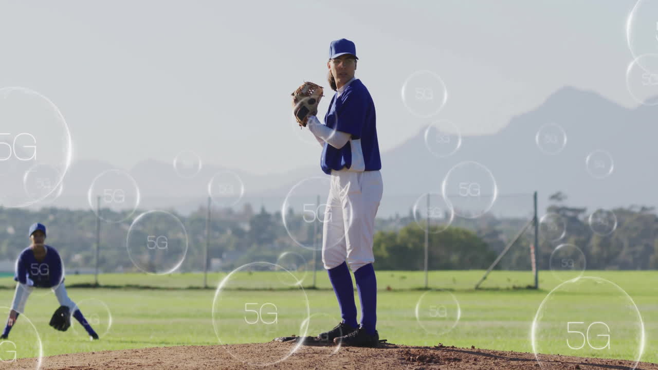 woman pitcher pitching beside ready fielder on baseball park in tech scene with floating 5G bubbles