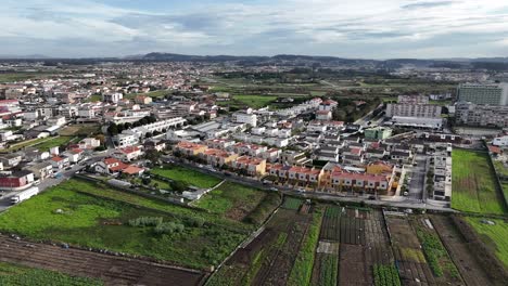 aerial - agricultural fields and residential buildings in póvoa de varzim, portugal