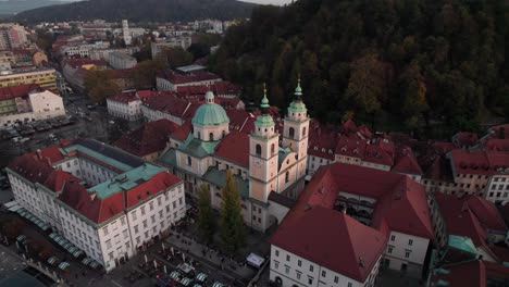 top-circle-pan-shot-of-Cathedral-of-Saint-Nicolas-in-Ljubljana-City-Slovenia-in-dusk-time