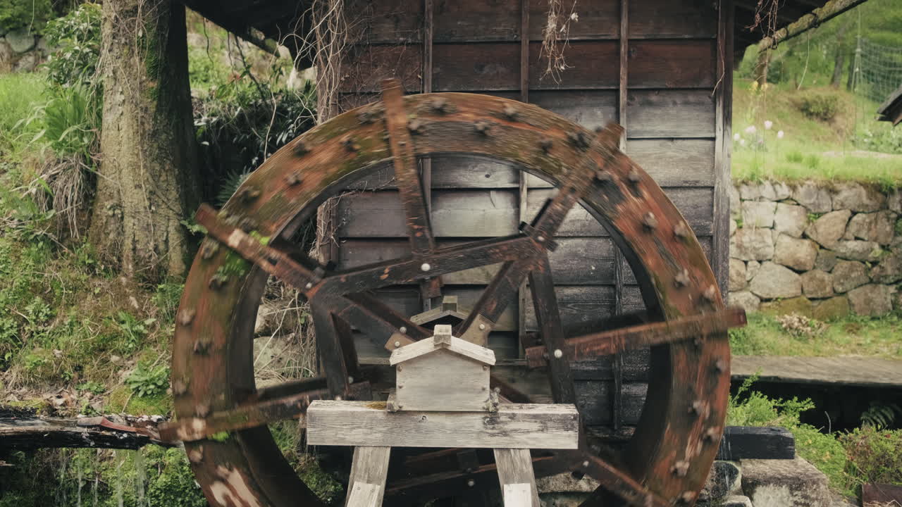 Antique Wooden Water Wheel in a Japanese Garden