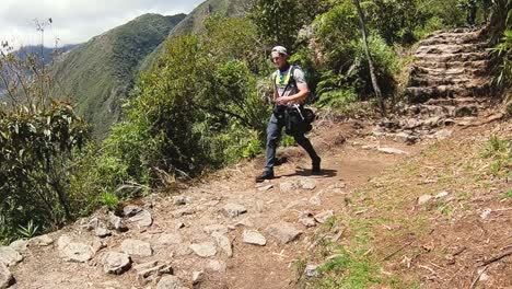 panning inca trail and revealing andes mountains with person walking