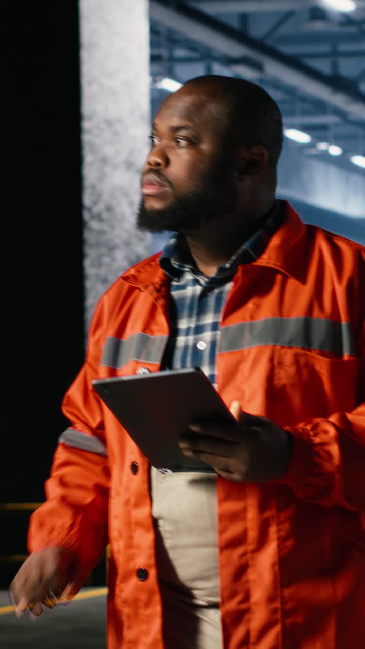 Vertical Video Specialist guiding colleague personnel with equipment as heavy machinery
