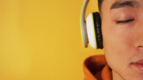 close-up of a person listening to music with headphones