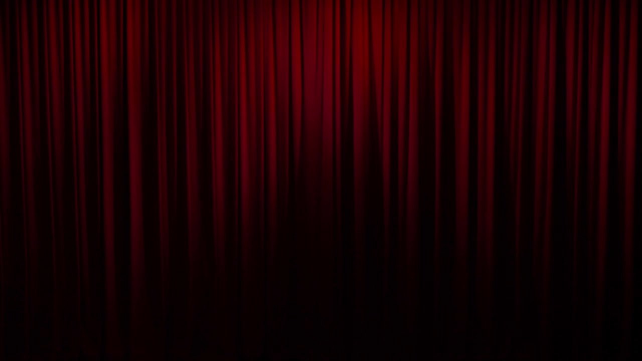 Closed deep red heavy theatre curtains or rags moving slowly between theatrical acts
