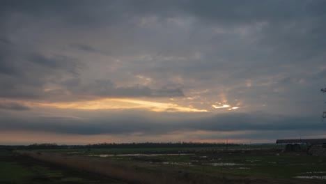 dramatic sunset over rural farmland