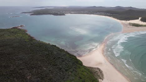 drone shot over fingal beach in new south wales, australia