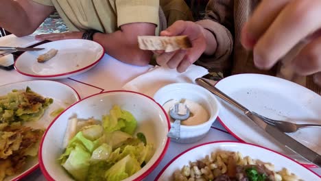 sharing a meal with truffle aioli spread