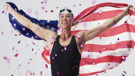 animation of confetti over caucasian female swimmer holding flag of usa