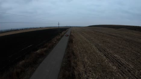 drone following the car in the evening