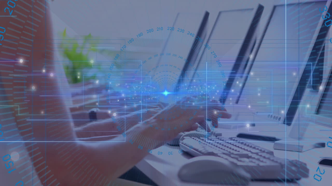 Hands typing on keyboard in office while data flow overlays animate across 3D monitors