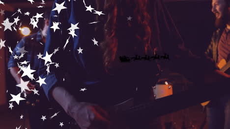 band members performing holiday music on dimly lit stage, showing animated stars and santa sleigh