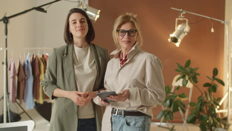 portrait of senior and young businesswomen at work in photo studio