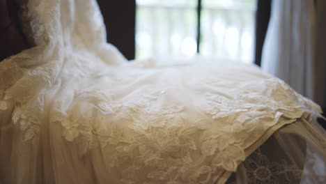 Wedding-dress-lays-in-ambient-room