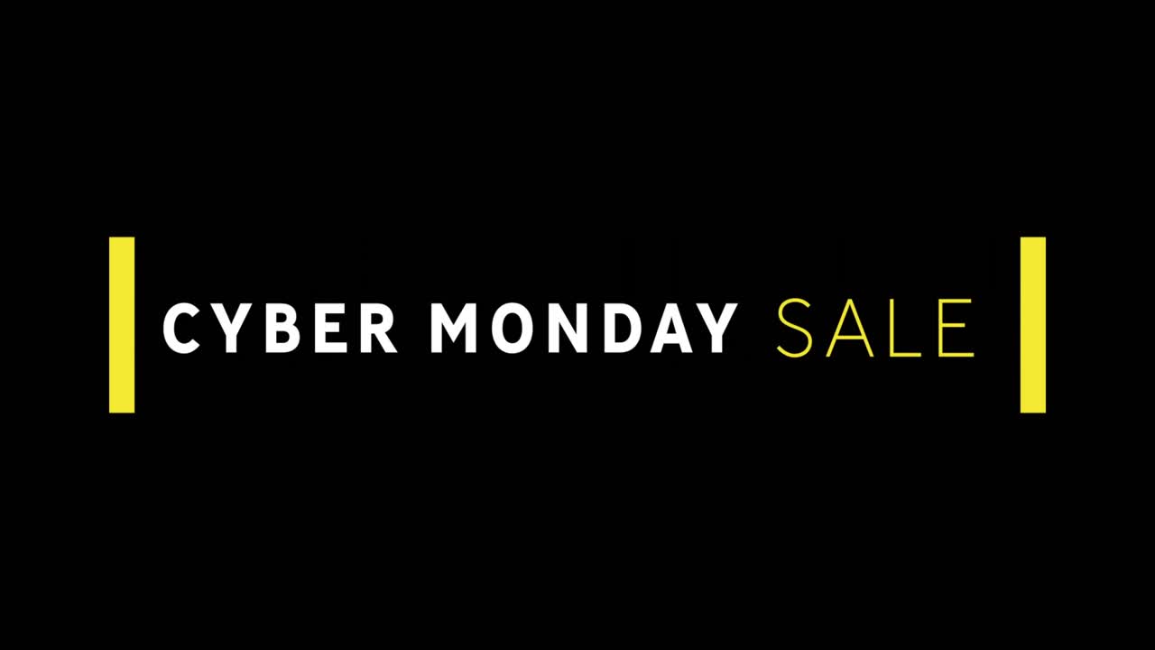 texto de venta blanco y amarillo de cyber monday que aparece contra una pantalla negra