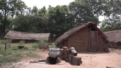 indigenous people in remote areas of india live in mud huts and thatched huts