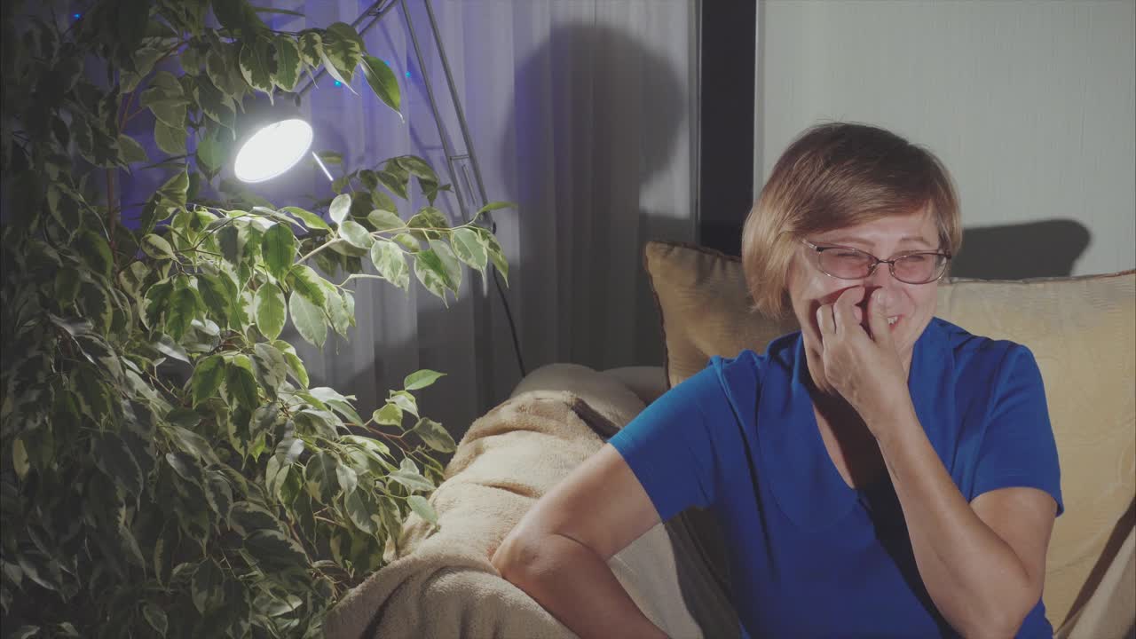 Woman relaxing at home at night