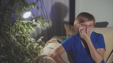 woman relaxing at home at night