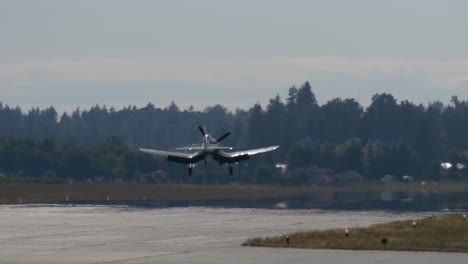 Rear-Shot-of-Historic-Warplane-F4U-Corsair-Landing-on-the-Runway