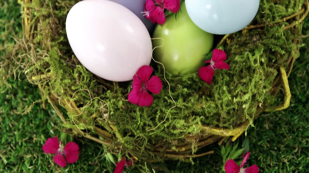 Multicolored Easter eggs in the nest