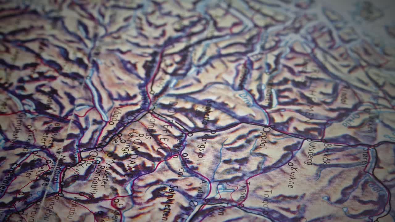 SLIDE SHOT REVEALS Pin placed in topographic route map of Norway mountains