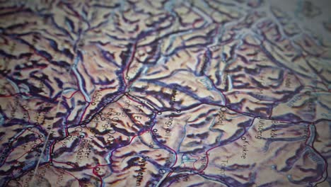 slide shot reveals pin placed in topographic route map of norway mountains