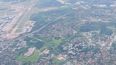 helsinki-vantaa airport from an airplane. ruskesanta and harjusuo areas also visible. it's the largest airport in finland and an important hub in northern europe