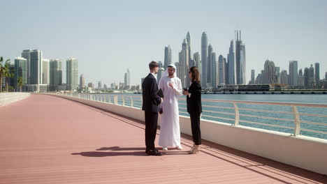 three people talking about business