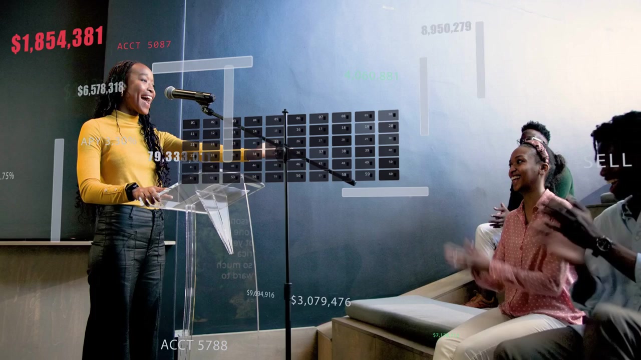 Vertical video: Woman walking to lectern, speaking into mic, presenting finance charts, peers clap