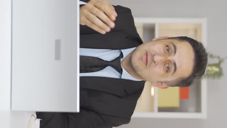 Vertical-video-of-Home-office-worker-man-gives-motivational-speech.