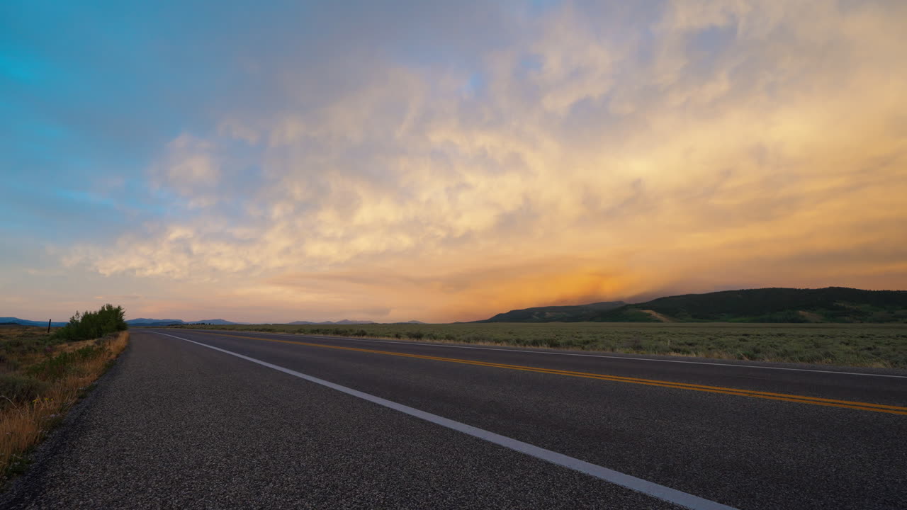 Desert Road Under a Dramatic Sunset Sky
