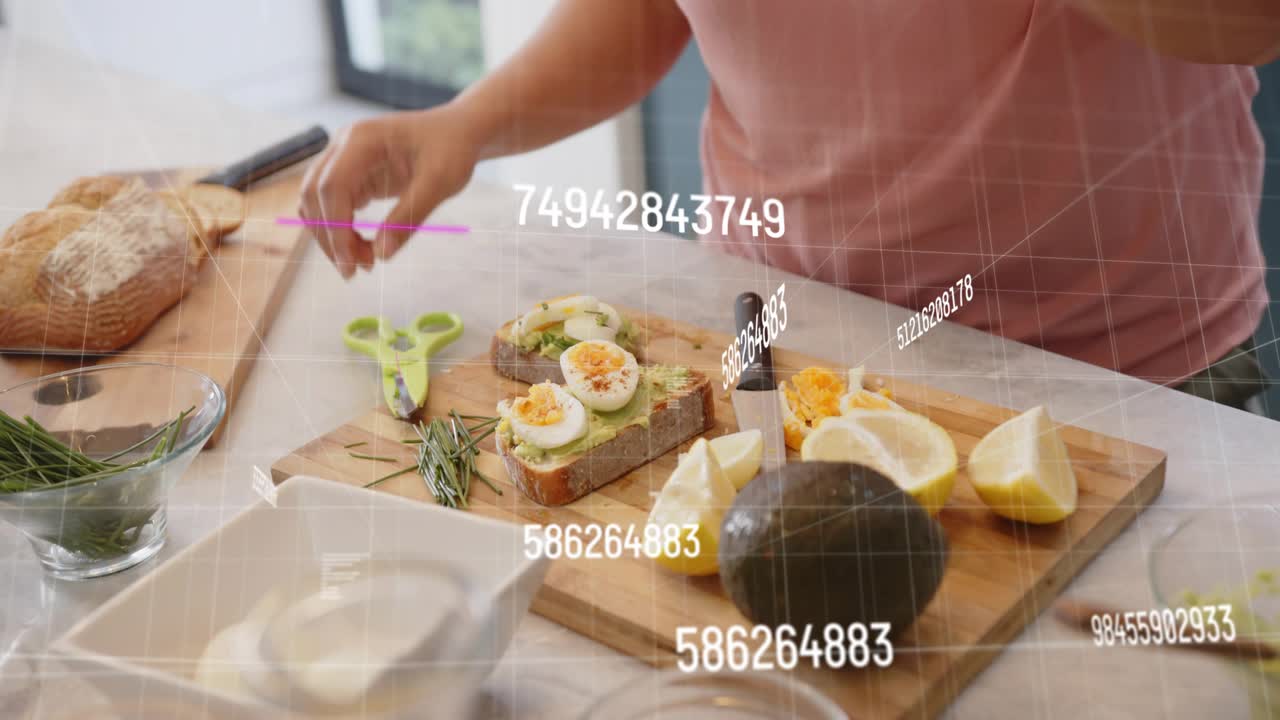 Cook picking ready toast activating AR overlays, placing sliced eggs, trimming rosemary for recipe