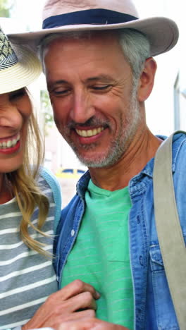 mature couple is looking a smartphone