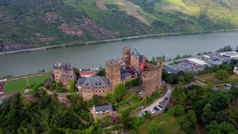 hilltop romantic castle hotel of schoenburg in oberwesel town overlooking middle rhine, germany