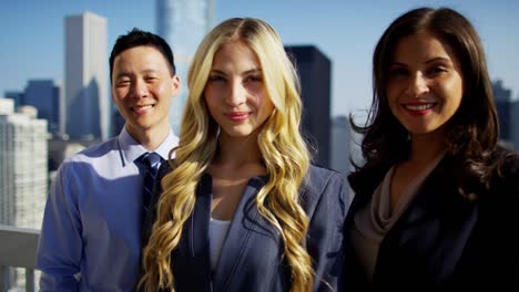 portrait of ethnic business colleagues on chicago rooftop