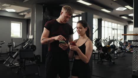 man and woman working out at the gym.