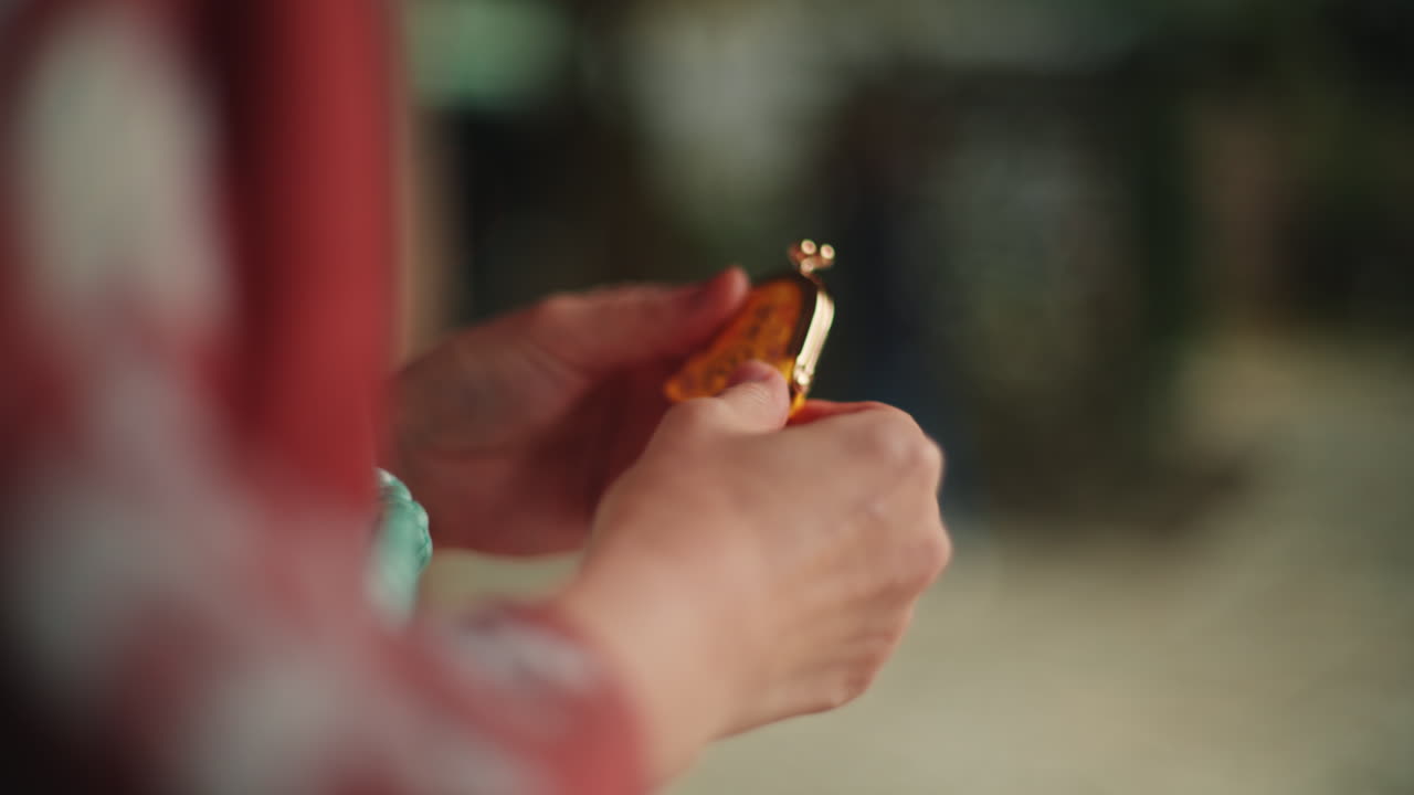 Close-up of hands holding jewelry