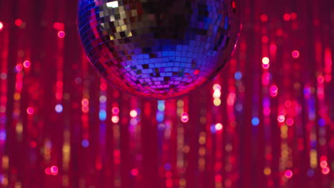 close up of mirrorball in night club or disco with flashing strobe lighting and sparkling lights in background 5