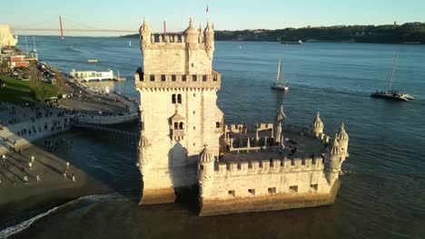 aerial view of the torre de belém at golden hour: a picturesque scene of history and beauty 09